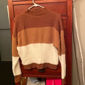 Knit sweater with warm colors. Fuzzy sized small.